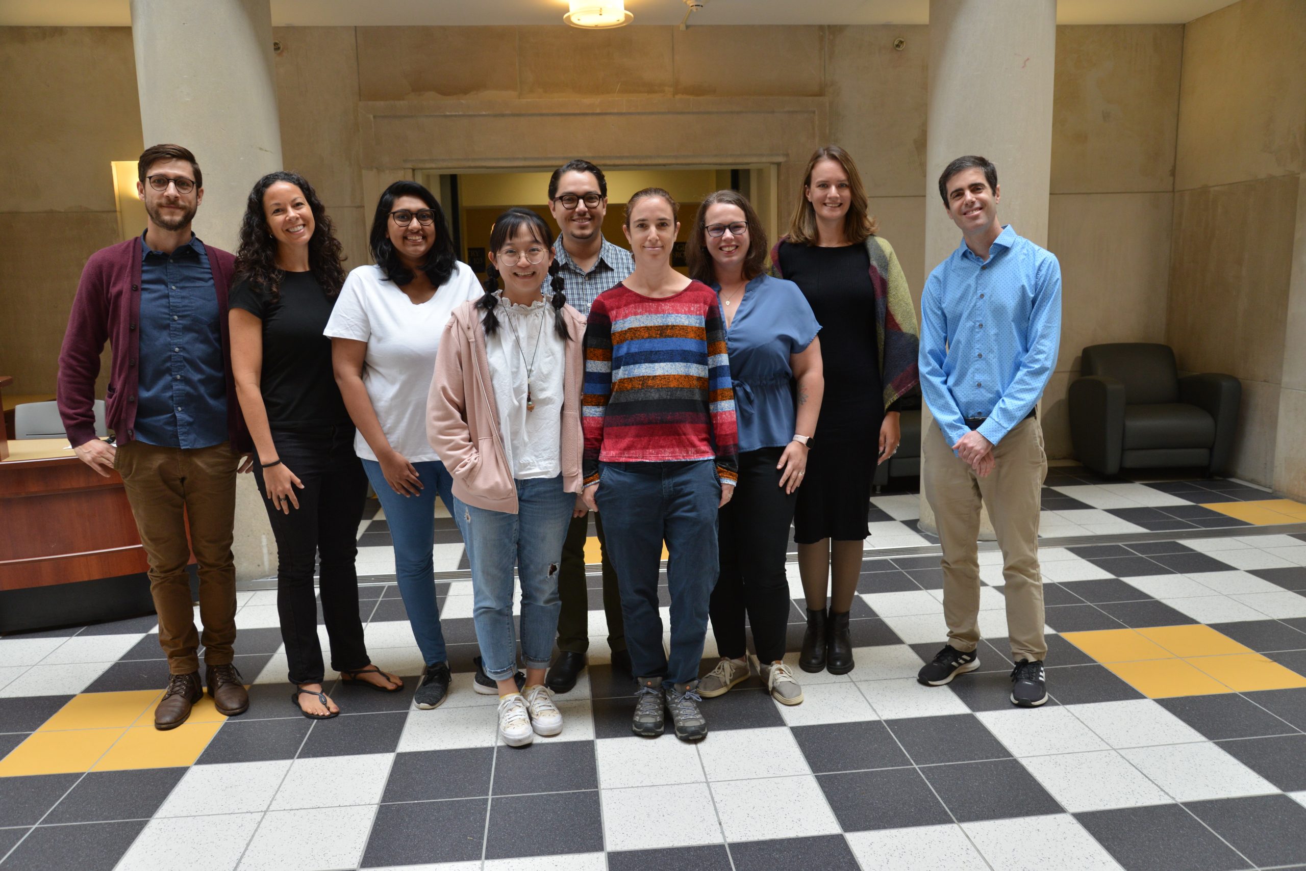 Lab to Classroom Research Group members standing in the Neag school atrium